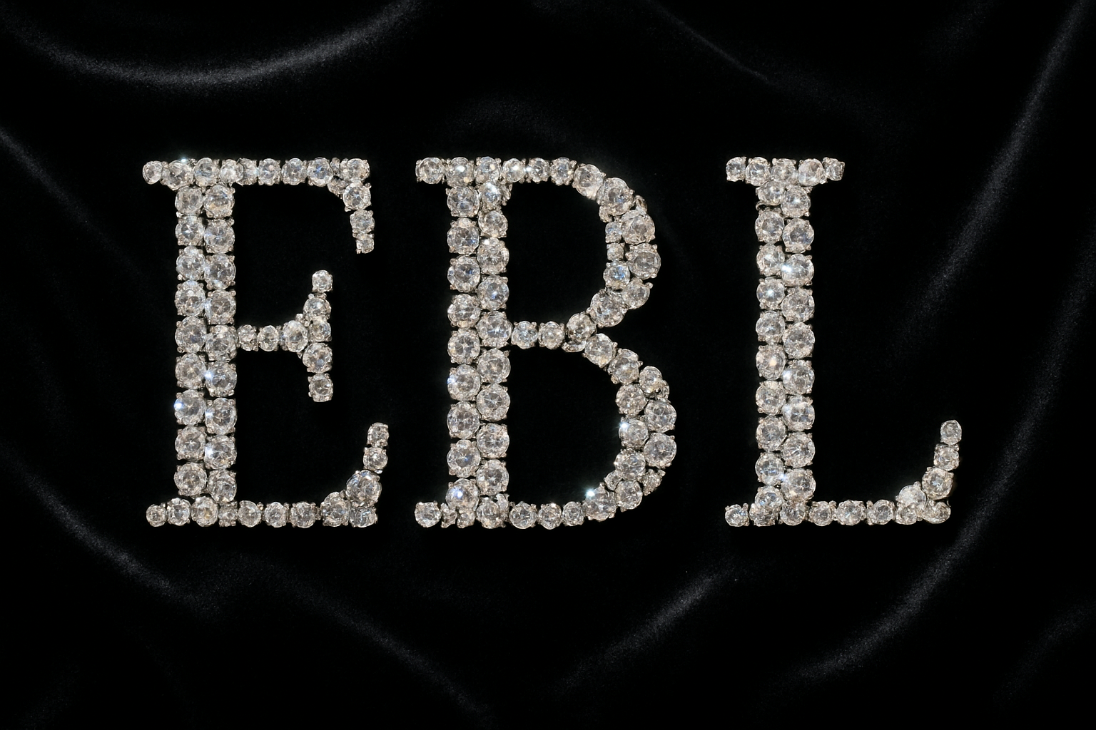 rhinestone E B L on a black velvet background